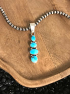The Vamo Turquoise Pendant, 2-Pendants-Calli Co., Turquoise and Silver Jewelry, Native American Handmade, Zuni Tribe, Navajo Tribe, Brock Texas