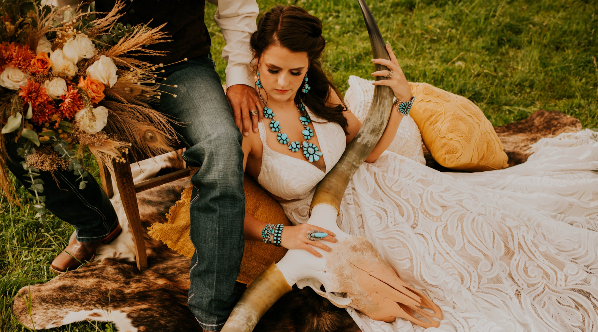 Bride and groom in a western style wedding backdrop. Bride is wearing turquoise and silver jewelry from Calli Co. Silver. 
