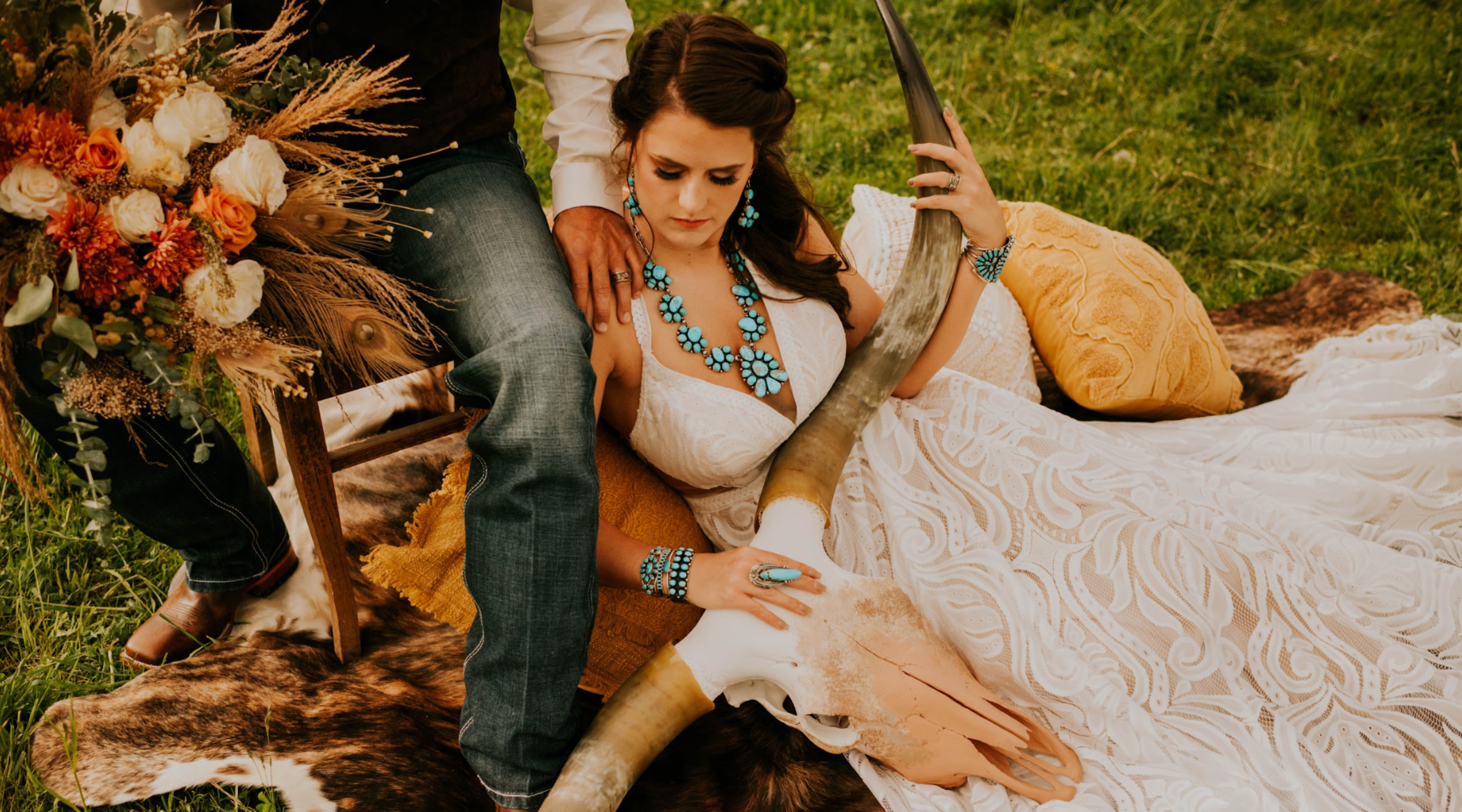 Bride and groom in a western style wedding backdrop. Bride is wearing turquoise and silver jewelry from Calli Co. Silver. 